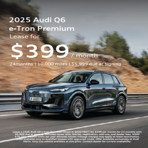 Angled front view of Audi Q6 e-tron driving 